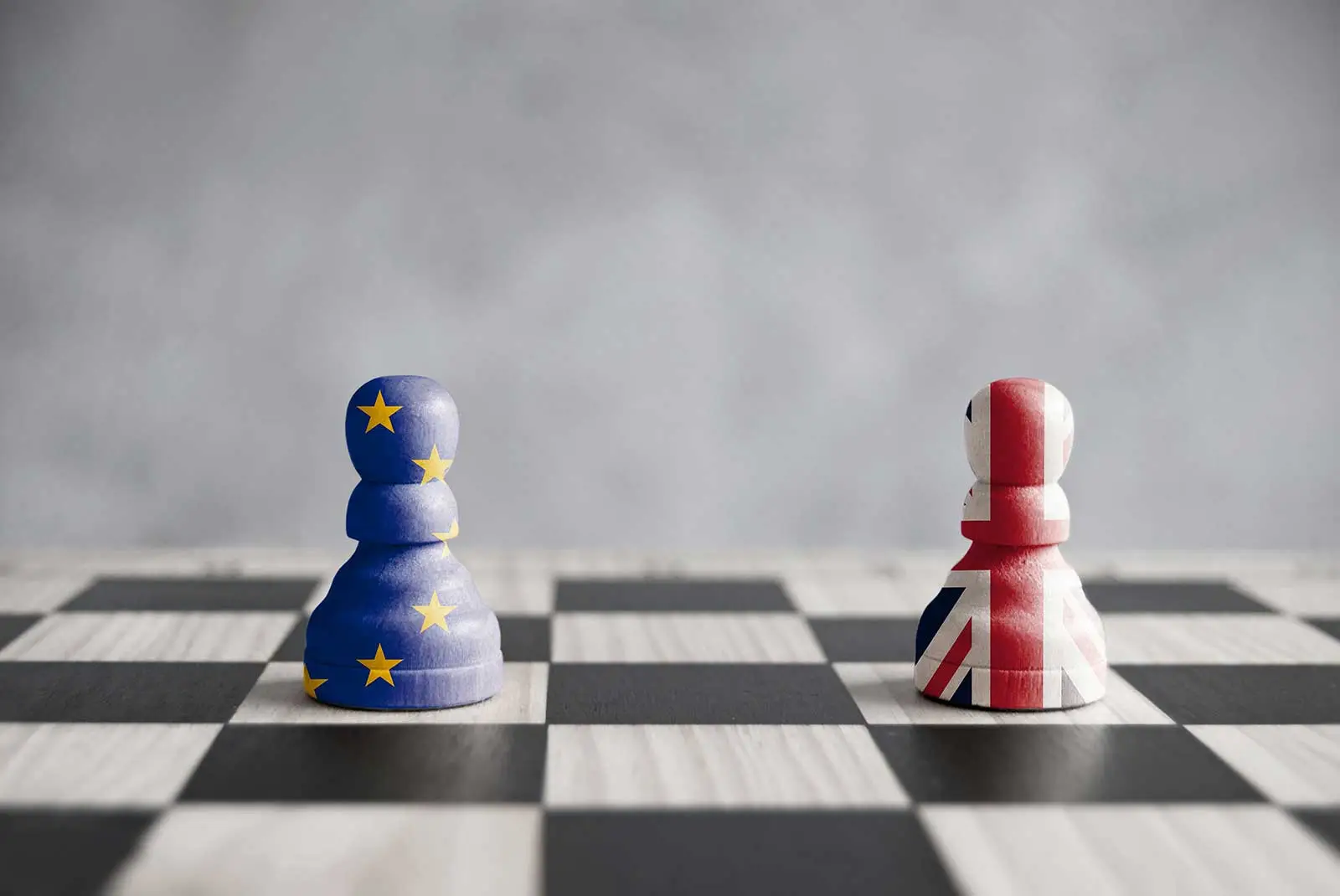 A chess board with an EU painted pawn and a UK painted pawn