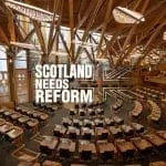 Holyrood debating chamber with the "Scotland Needs Reform" logo overlayed