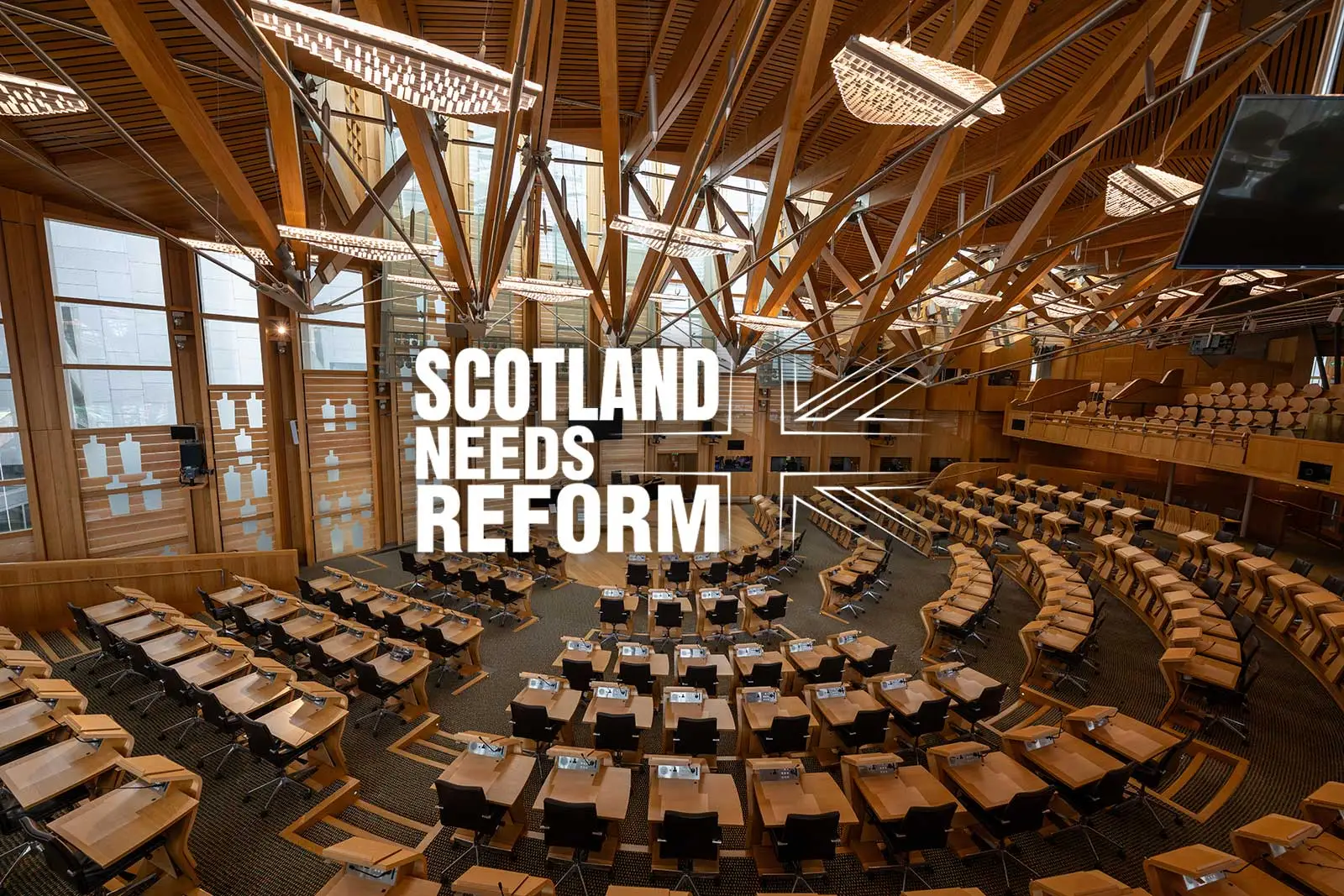 Holyrood debating chamber with the "Scotland Needs Reform" logo overlayed