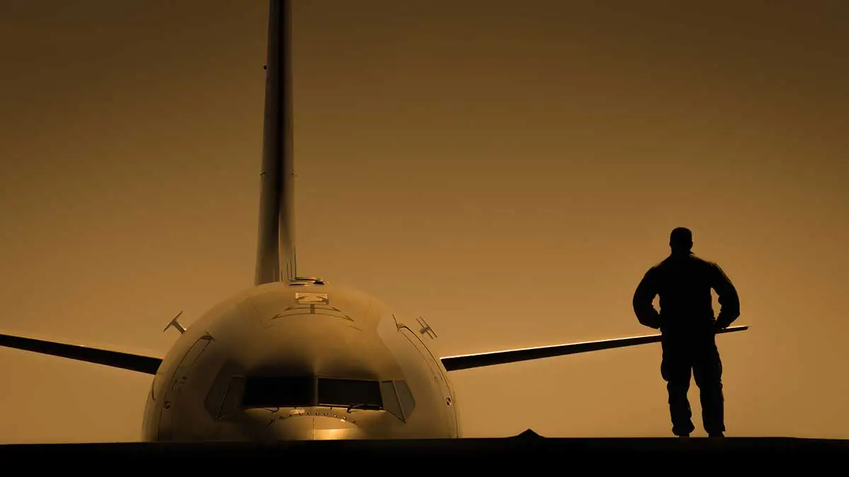 Passenger aircraft on runway at sunset