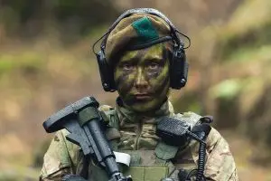Female British soldier in full camouflage