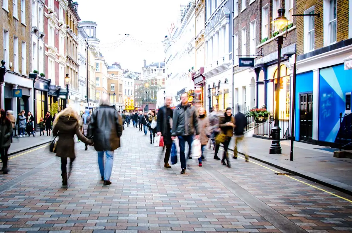 Busy shopping street with pedestrians