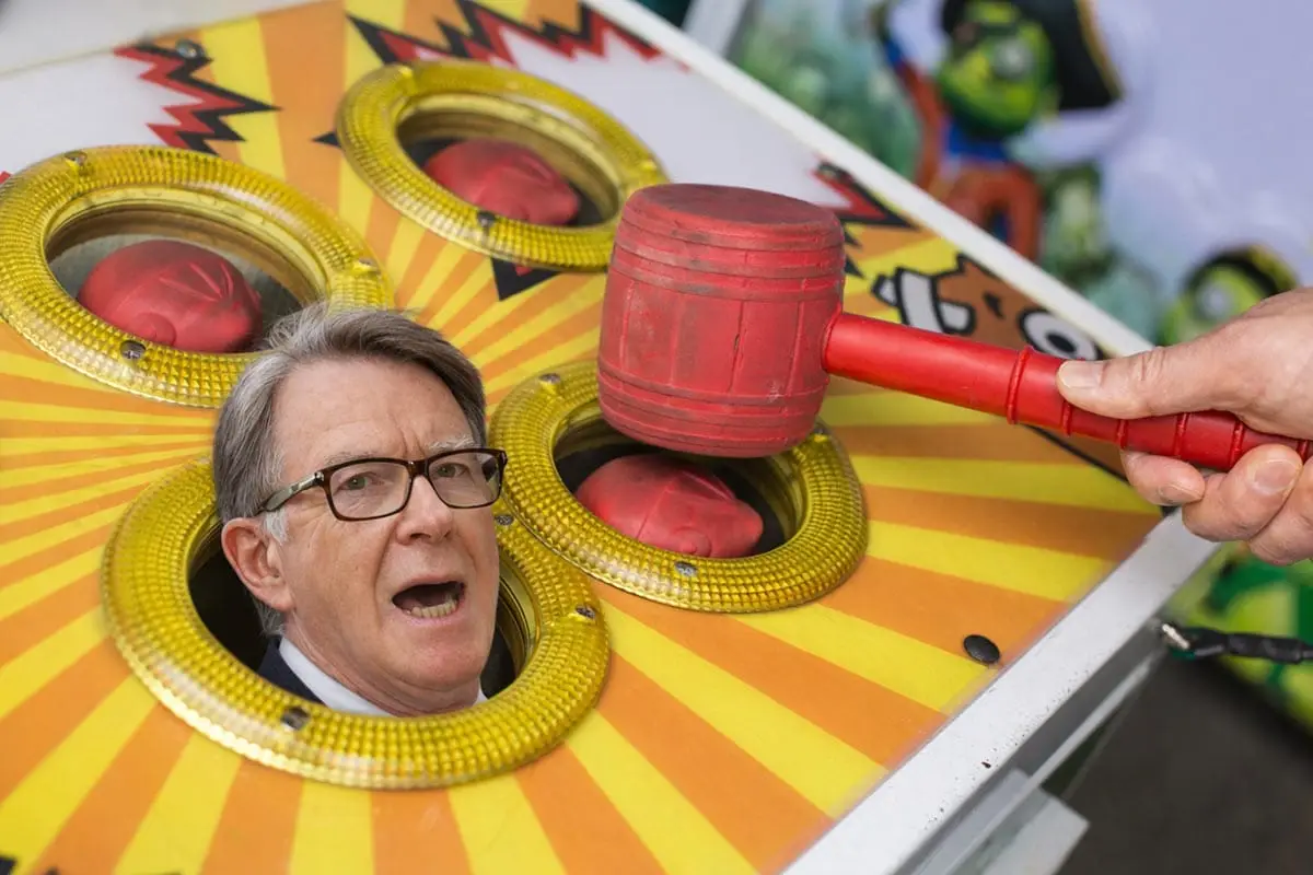 A game of whack a mole with the face of Peter Mandelson popping up