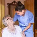 Care Home worker with elderly person