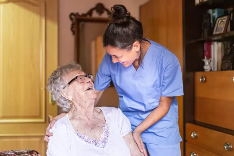 Care Home worker with elderly person
