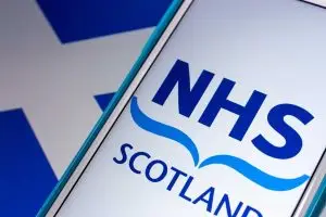 NHS Scotland logo on smartphone