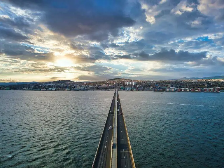 View along the Tay Road Bridge toward Dundee at sunset, with traffic crossing over the River Tay